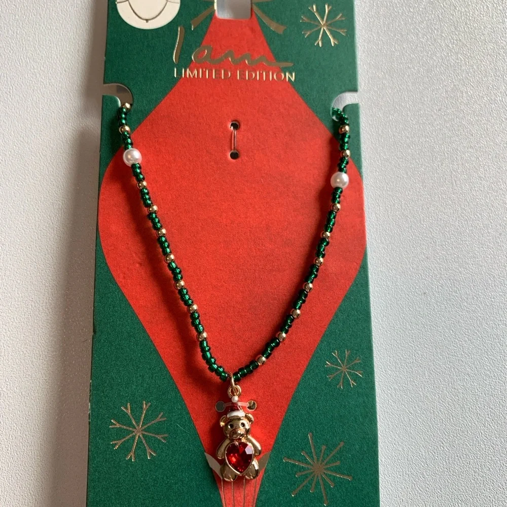 Sweet little Christmas bear necklace with red heart belly.